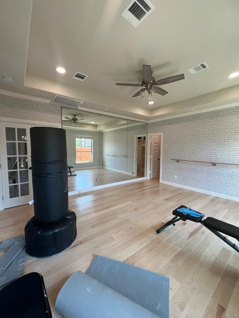 Garage conversion in Katy TX finished as a mirrored home gym and workout studio